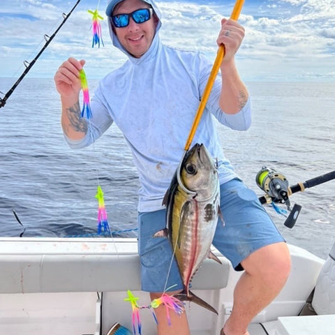 Guy with a Tuna caught on a Fathom bird chain in Rainbow.